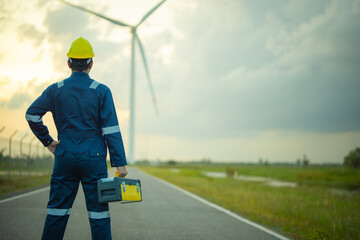 Renewable energy maintenance. Engineer wearing uniform inspection and survey work in wind turbine...