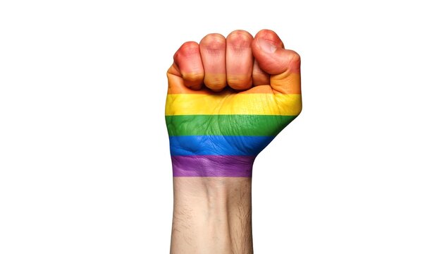 A hand, clenched into a fist, displays a rainbow flag design on the skin, set against white