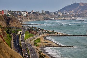warm sunny afternoon in Miraflores, with the Pacific breeze and El Morro Solar rising in the...
