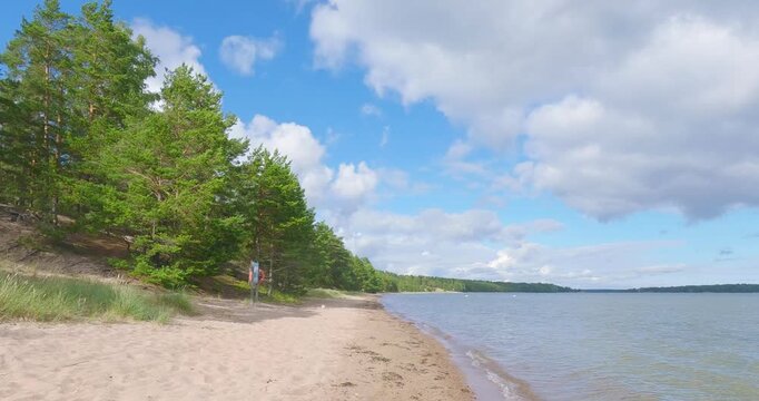 Lappohjanranta is a great sand beach for swimming and sunbathing in summer with clouds in the sky, Hanko, Finland.