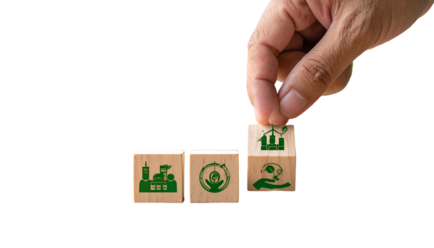 A hand places a block with green eco-icons onto a line of wooden blocks, black bg