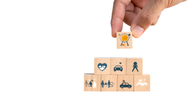 Hand placing a block with a target icon on top of a stack of blocks - Powered by Adobe