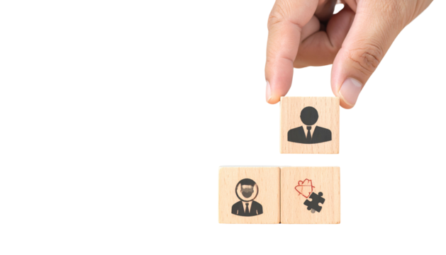 A hand places a person icon block above two other blocks, one person icon & a puzzle