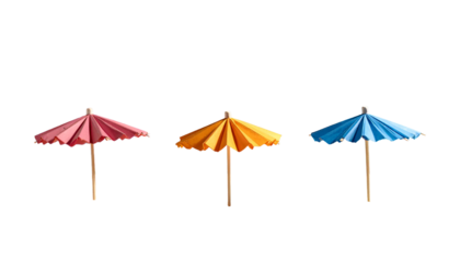 Three colorful paper cocktail parasols stand against a black background