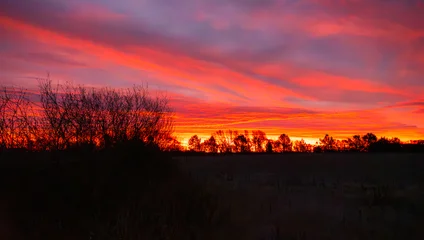 Selbstklebende Fototapeten Hochrot Autumn sunrise on the prairie  © Krista