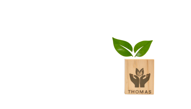 Wooden block with leaves and hands cradling plant symbol. "Thomas" is below. Black background