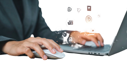 Person in suit uses laptop with floating icons, conceptualizing digital workflow