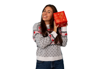 Happy young woman smiling, holding a wrapped red gift box, celebrating holiday season. Transparent background