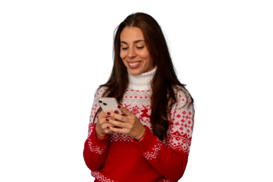 Woman wearing christmas sweater using smartphone, texting messages and connecting during winter holidays
