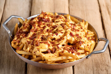  french fries with cheddar cheese and bacon