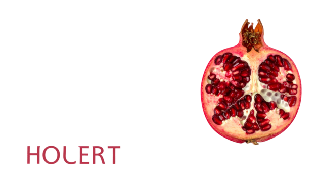 Vivid half pomegranate against a black background with a stylized word