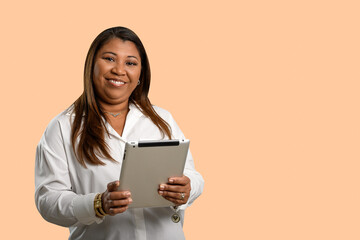 Fototapeta premium Smiling professional woman holding a tablet.