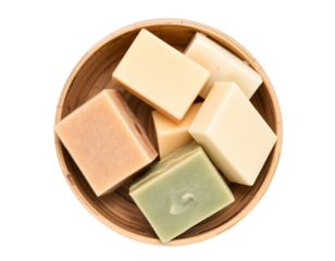 Assortment of handmade soaps in a wooden bowl isolated on transparent background
