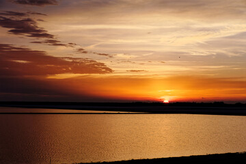 Obraz premium Sunset over salt pond 