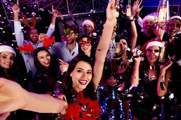 Epic office party night crowd dancing celebration with festive outfits and neon lights at a lively nightclub event