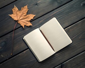 Open notebook and a maple leaf on a dark wooden surface in autumn season