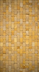 Fototapeta premium Vertical wall texture made of sandy yellow and beige stone bricks, perfect for backgrounds, architectural design, and historical facades ,backdrop ,masonry ,rough