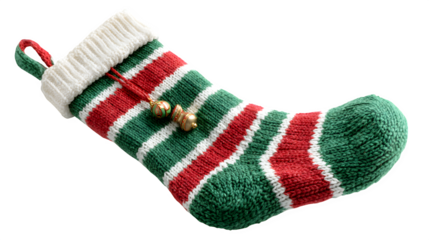 Knitted Christmas stocking in green and red stripes with a white cuff and jingle bell charm, cozy and traditional, isolated on white background