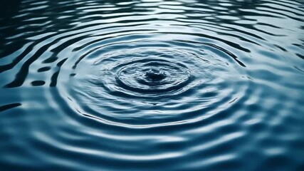 Close-up of Ripples on the Surface of Calm Water Creating Concentric Circles