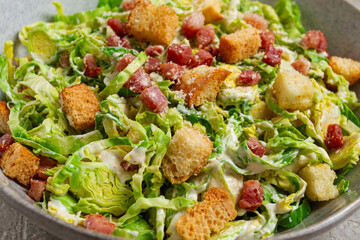Brussels sprouts Caesar salad, with bacon and croutons, healthy food, homemade, no people,