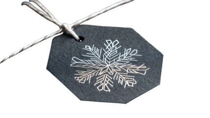 Modern gift in graphite paper with white geometric snowflake and thin silver thread, architectural design, isolated on white background