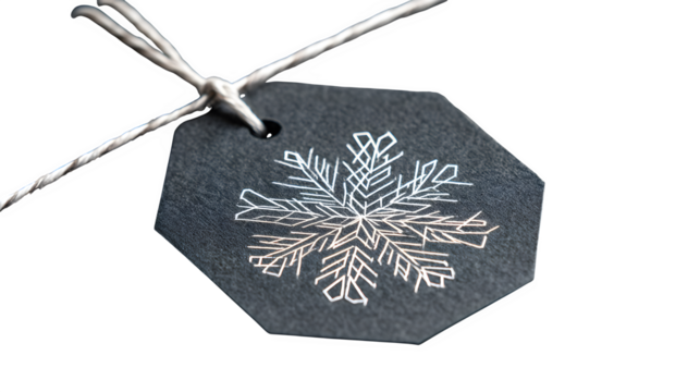 Modern gift in graphite paper with white geometric snowflake and thin silver thread, architectural design, isolated on white background