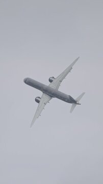 Large black commercial jet airplane during flight