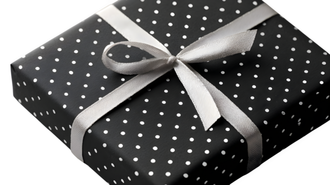 Modern gift in matte black paper with minimalist white dot pattern and thin white ribbon, sleek and elegant, isolated on white background