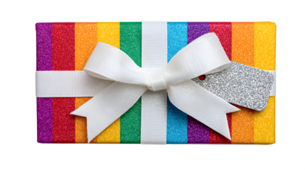Playful gift in rainbow stripe paper with oversized white bow and glitter tag, joyful and bright, isolated on white background