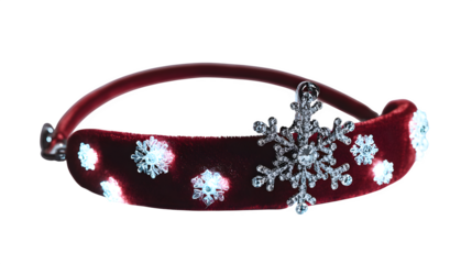 Red velvet hair band with embedded micro LED lights and snowflake charm, glowing festive headwear, isolated on white background