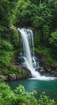 Misty Atmosphere Waterfall with Emerald Greens. Photorealistic Multi-tiered Waterfall in Jungle. Cascading Waterfall with Saturated Colors.