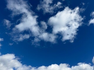Fluffy clouds in the blue sky.