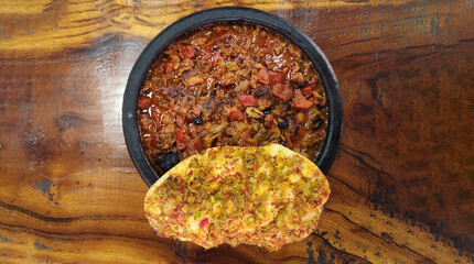 Belen Tava is a traditional Turkish dish made with tender beef, tomatoes, green peppers, garlic, olive oil, and spices, baked to perfection for a rich, aromatic flavor