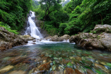 Fototapeta premium Waterfall cascading through lush greenery in a serene natural landscape