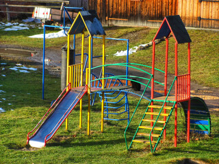 Colorful children's playground in early spring