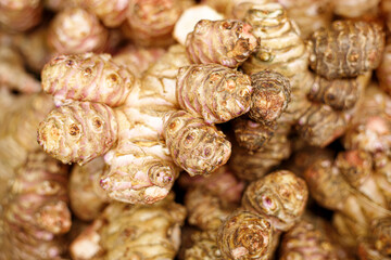 Ginger root on the counter in the store. Trade in fresh vegetables in the trading network.