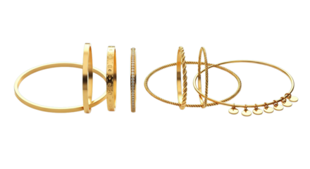 Collection of elegant gold arm bracelets and bangles with intricate details isolated on black background