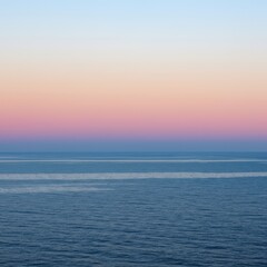 Obraz premium Tranquil ocean expanse at sunset. The deep blue water meets the soft gradient sky precisely along the endless horizon line ,summer ,calm ,tropical
