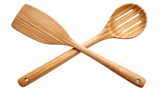 Wooden spatula and slotted spoon crossed isolated on transparent background for cooking needs