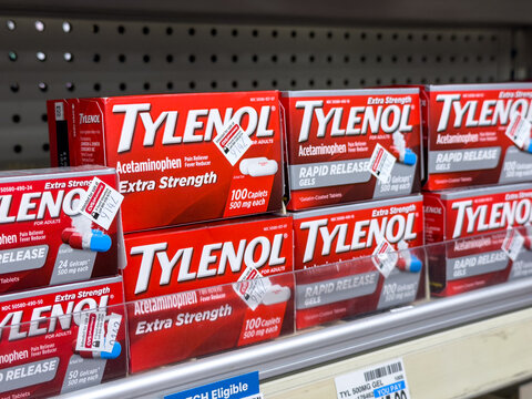 Small cartons boxes containing plastic bottles of TYLENOL Extra Strength Pain Reliever Capsules for sale at a California local pharmacy store	