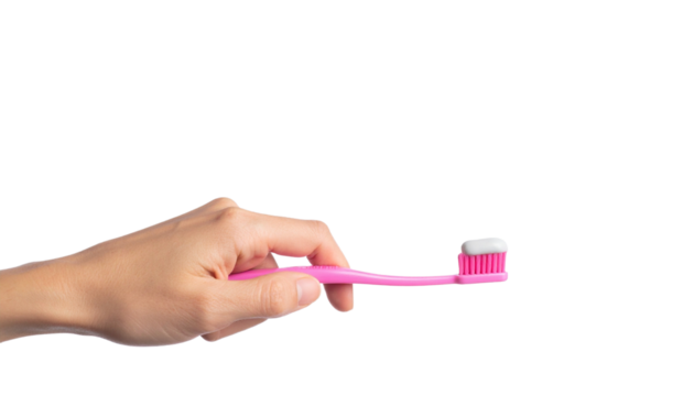 A hand holding a pink toothbrush with toothpaste applied 