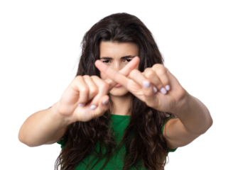 Portrait of a serious young woman showing stop gesture with her palm over white background