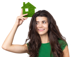 Happy house buyer. A young girl holds a model of a green house in her hands. The concept of green energy, ecology.
