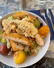 Crispy Chicken Salad with Heirloom Tomatoes and Parmesan Crisp on Blue Toile Tablecloth