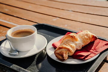 Morning Coffee and Croissant on a Sunny Terrace
