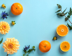 Vibrant Citrus and Floral Arrangement on Light Blue Background.