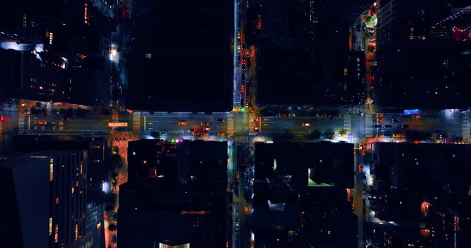 Highway and crossroads with lively traffic at night. Descending over the street of New York, USA.