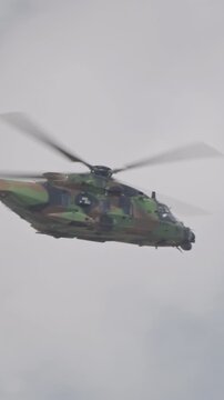 military helicopter performing combat flight maneuvers