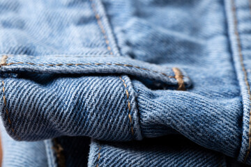 The denim is light blue. Denim background.