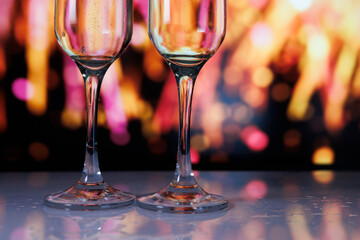Startup team toasts to success in trendy lounge with colorful reflections and upbeat music